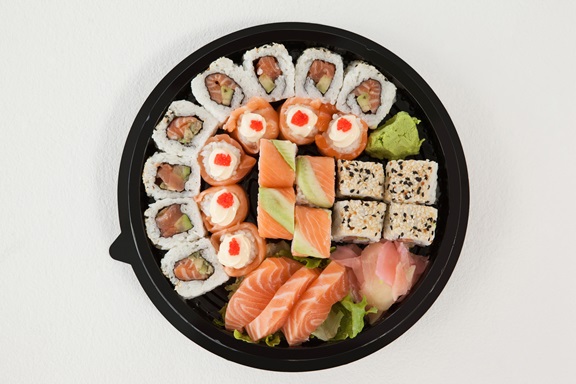 Set of assorted sushi kept in a round black box