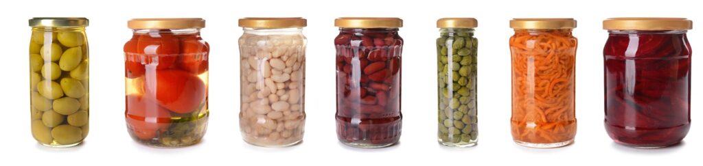 Jars with different canned vegetables