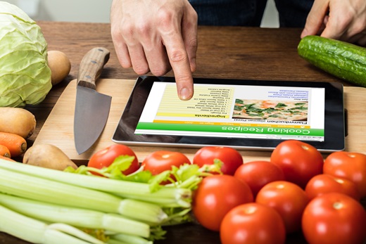 Person Is Preparing Recipe Using Digital Tablet