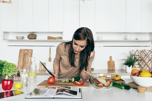 Woman reading cookbook