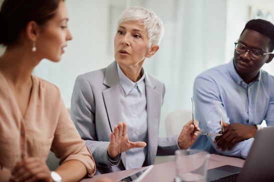 CEO talks to her young colleagues