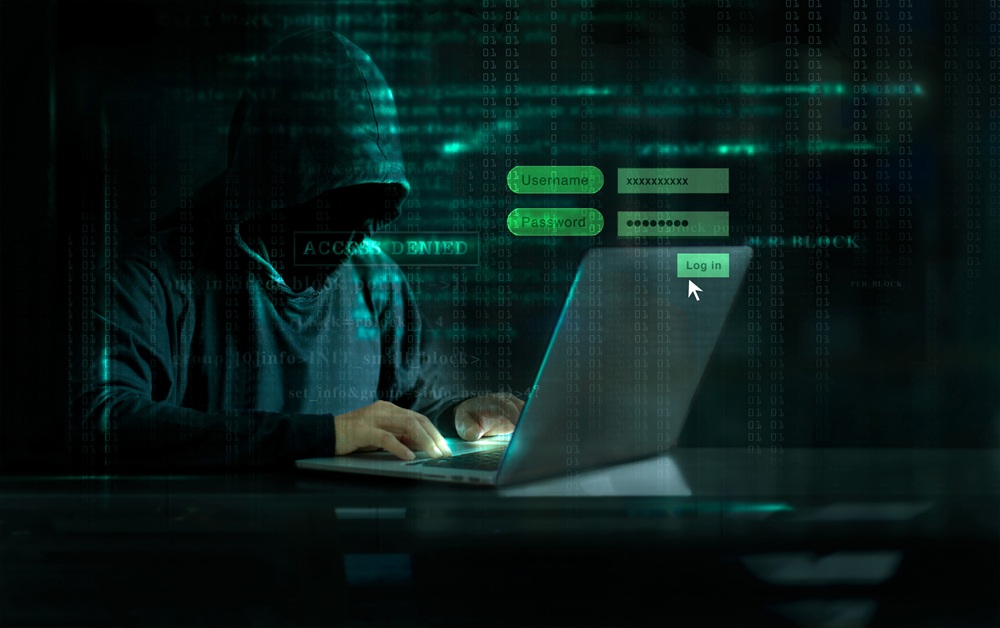 Hacker using laptop and Log On Screen with digital code on dark background. Cyber attack concept