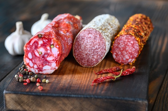 Assortment of salami on the wooden board
